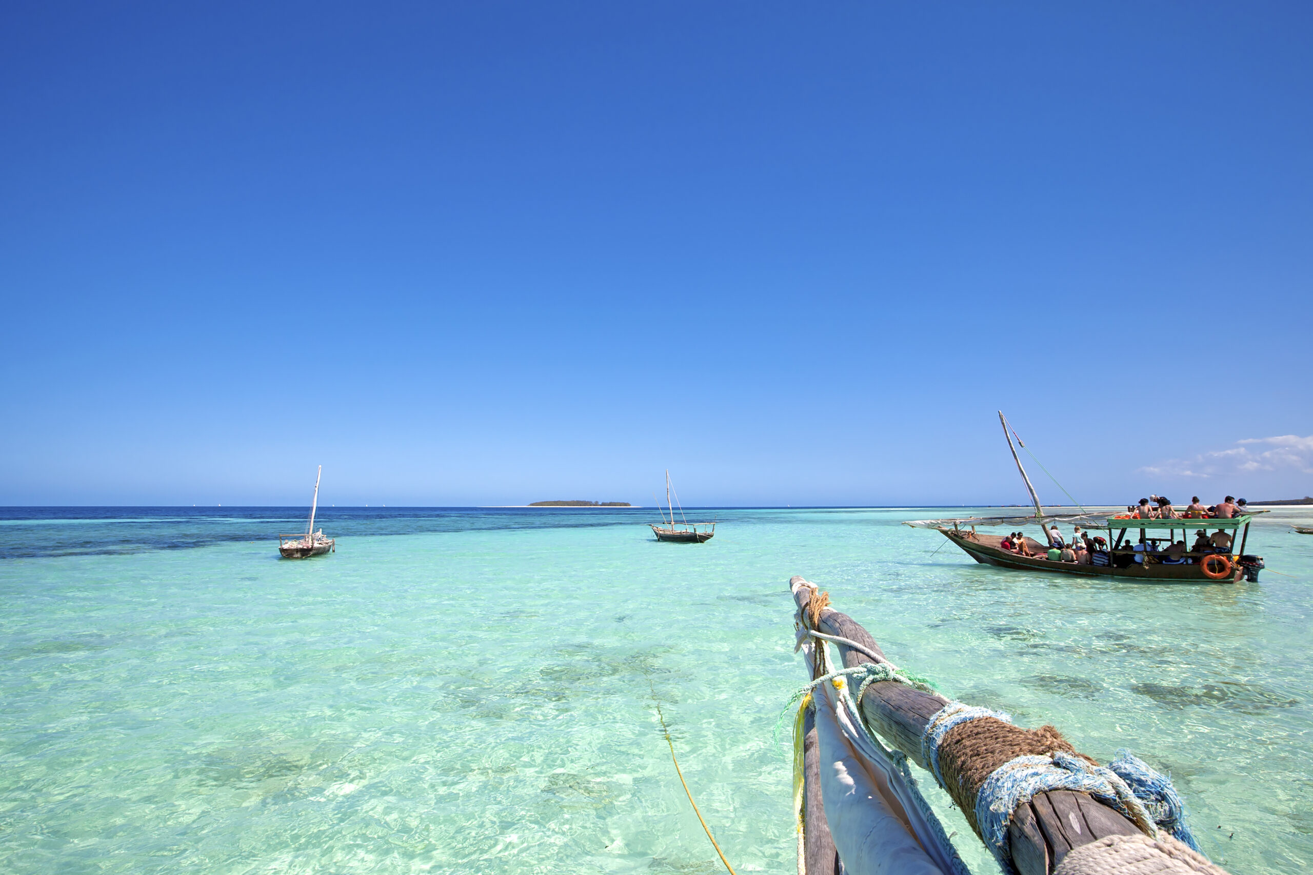 A boat trip over crystal clear tropical waters in the island of Zanzibar